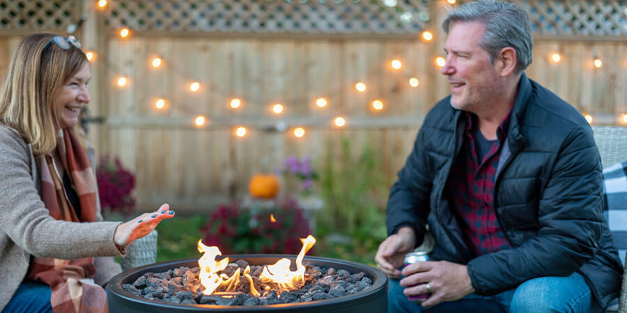 Couple outside near firepit