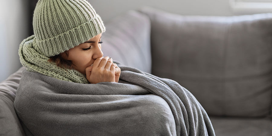 Woman cold on couch